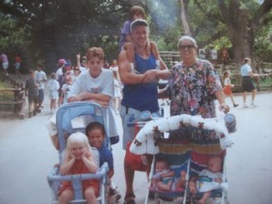 A much earlier zoo trip - this time to the Ft. Worth Zoo. Across back: Son Russell, son Greg with his Mercedes on his shoulders, and Grami. In 1st stroller, Michael and Naomi, and twins Caryn and Anna in 2nd stroller.