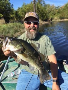 Matt McAdoo, Caryl's firstborn, pulls a big bass out of 'McAdoo Lake'
